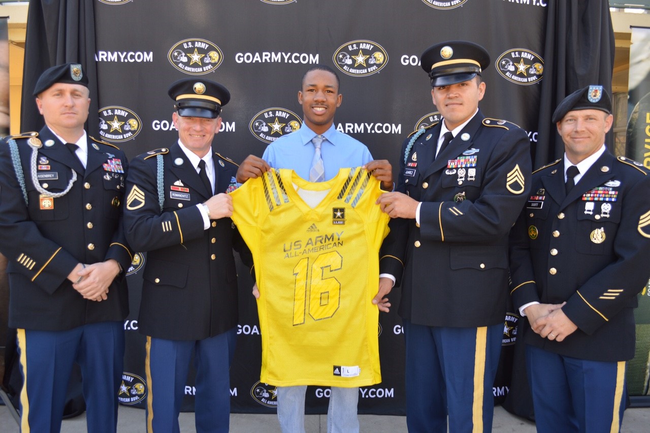 Jack Jones receives his honorary jersey for the Army All-American Bowl from (from left): Sergeant First Class Giles Aisenbrey, Staff Sergeant Greg Romanovitz, Staff Sergeant Jose Juarez and Staff Sergeant Eric Scott.