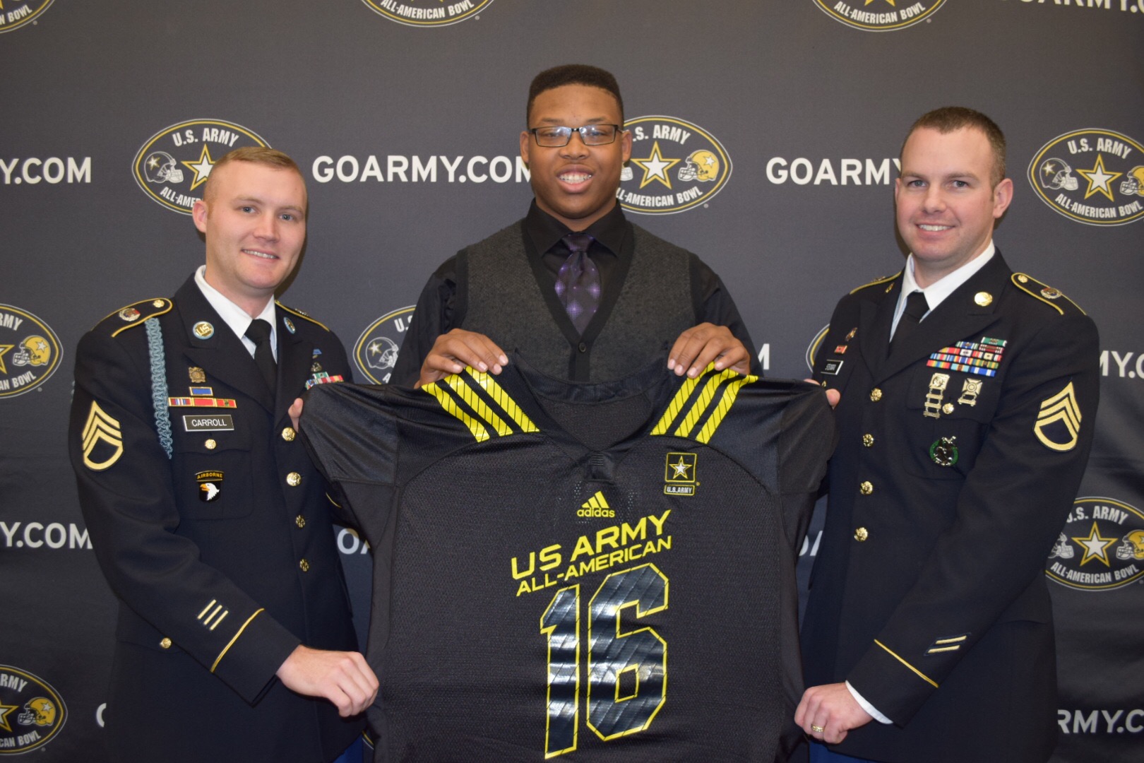 Michael Jordan is presented his Army jersey by (from left) Staff Sergeant Steven Carroll and Staff Sergeant Jeffery Stendman. (Photo: Army All-American Bowl)
