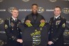 Michael Jordan is presented his Army jersey by (from left) Staff Sergeant Steven Carroll and Staff Sergeant Jeffery Stendman. (Photo: Army All-American Bowl)