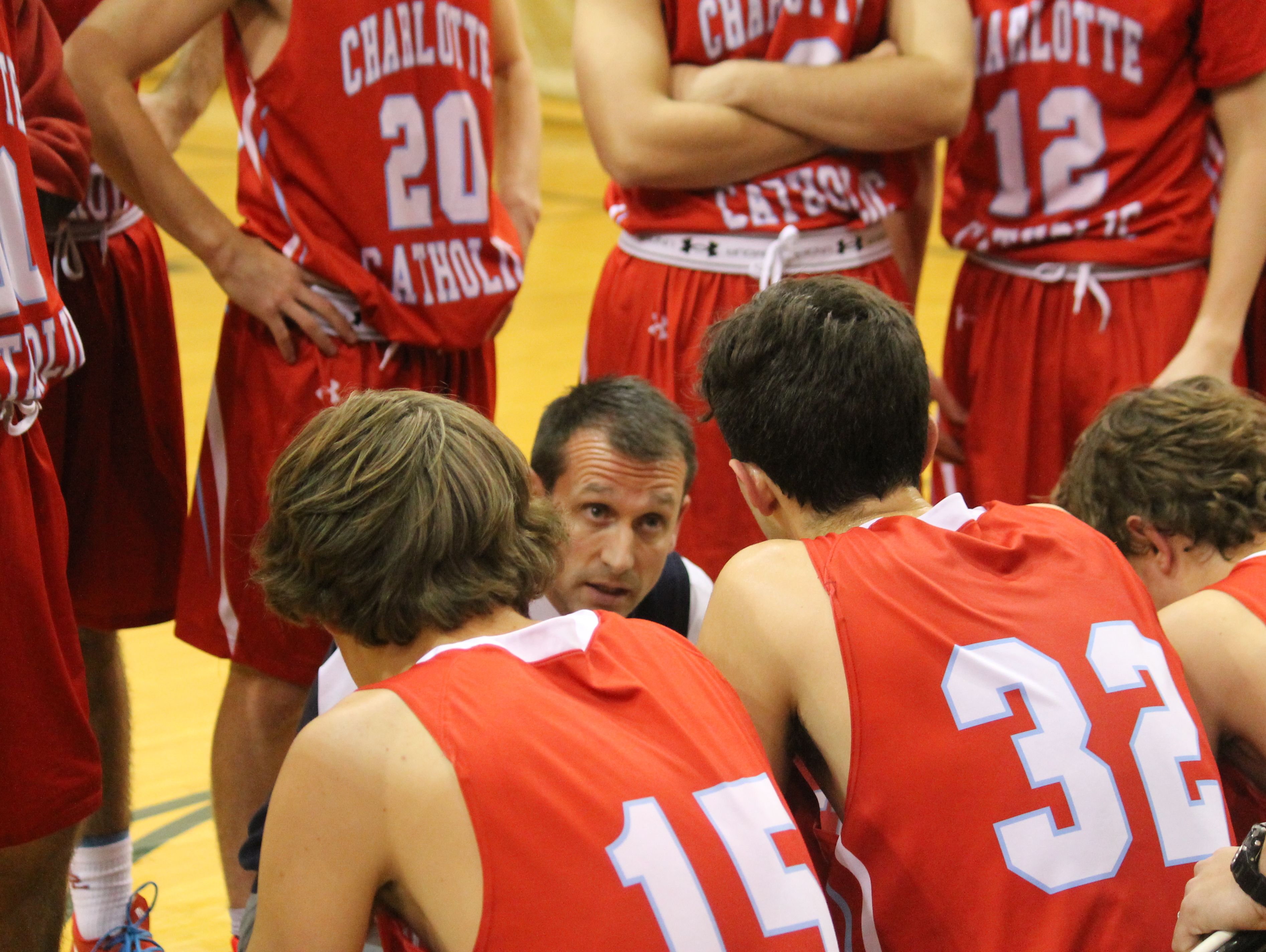 Coach King talks to the team during a time out. 