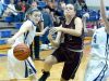 Stuarts Draft's Rachel Sauder tries to slip between Fort Defiance's Erin Henderson and Emily Humphries but Henderson strips the bats the ball away from her as she tried to reach the basket during a basketball game played in Fort Defiance on Friday, Dec. 11, 2015.