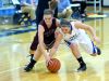 Stuarts Draft's Rachel Sauder and Fort Defiance's Lizzie Doughty chase after a loose ball during a basketball game played in Fort Defiance on Friday, Dec. 11, 2015.