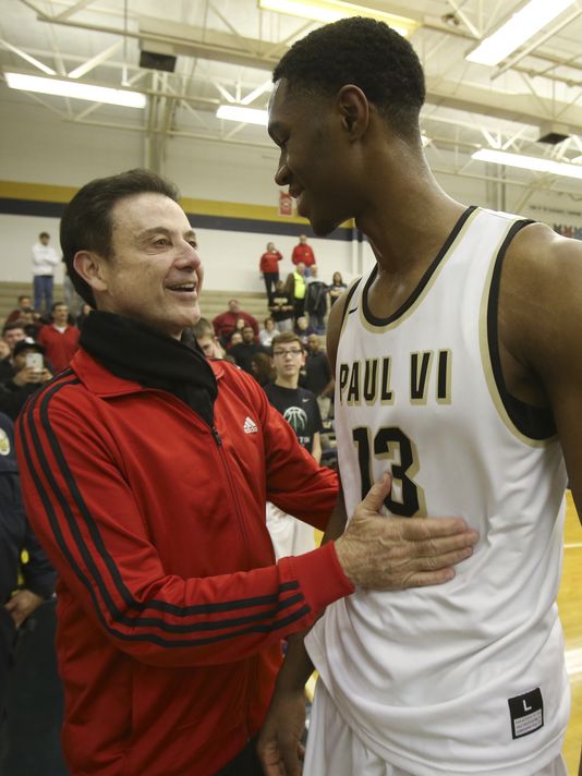 Louisville coach Rick Pitino greeted signee V.J. King, after his Paul VI Catholic High School squad defeated the North Bullitt High School in the King of the Bluegrass Tournament (Photo: Sam Upshaw Jr., Courier-Journal)