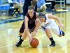 Stuarts Draft's Rachel Sauder and Fort Defiance's Lizzie Doughty chase after a loose ball during a basketball game played in Fort Defiance on Friday, Dec. 11, 2015.