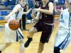 Stuarts Draft's Rachel Sauder tries to slip between Fort Defiance's Erin Henderson and Emily Humphries but Henderson strips the bats the ball away from her as she tried to reach the basket during a basketball game played in Fort Defiance on Friday, Dec. 11, 2015.
