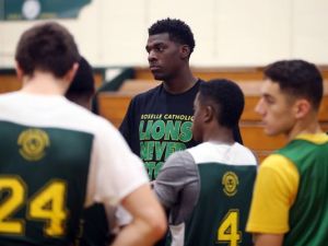 Roselle Catholic's Nazreon Reid in a team huddle during a pre-season basketball practice, Monday, December 14, 2015, in Roselle. (Photo: Jason Towlen/Staff Photographer)