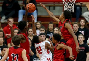 New Albany's Romeo Langford (1) blocks a shot by Pike's Justin Thomas (12) during the Tip Off Classic on Dec. 12, 2015.