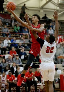 New AlbanyÕs Romeo Langford (1) goes up for the shot and is fouled by PikeÕs Durante Lee (52) during the Tip Off Classic on Dec. 12, 2015.