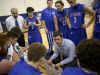 St. Clair coach Shawn Sharrow talks with players in a huddle during a basketball game Friday, Dec. 11, 2015 at Marysville High School.