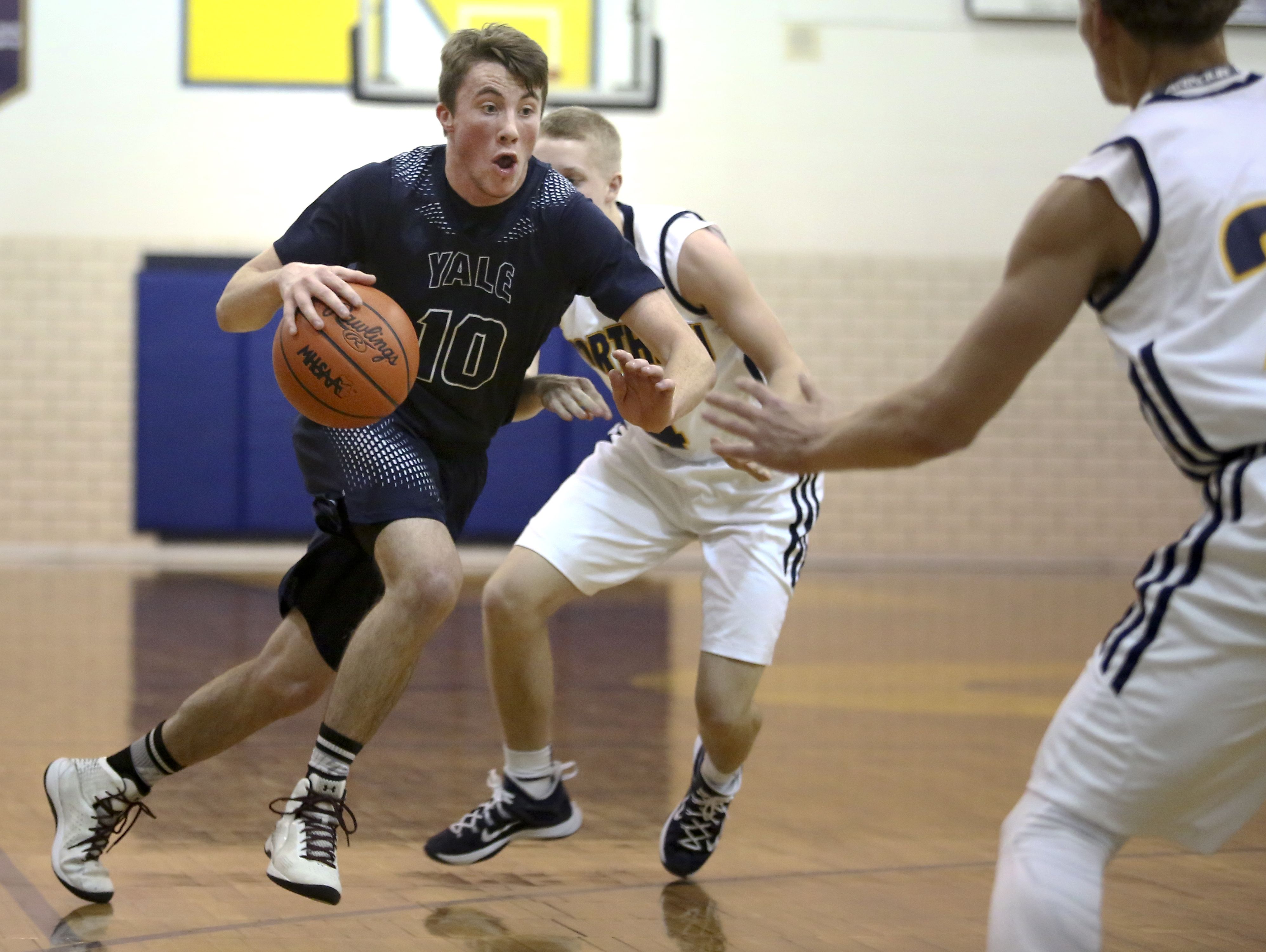 Yale senior Cody Kegley drives the ball down court during a basketball game Tuesday, Jan. 5, 2016 at Port Huron Northern High School.