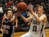 Stuarts Draft's #11, Evan Burgener drives to the basket past Luray's #00, Trea Atkins at Stuart Draft High School during their boys basketball game Monday, Jan. 11, 2016