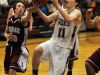 Stuarts Draft's #11, Evan Burgener drives to the basket past Luray's #00, Trea Atkins at Stuart Draft High School during their boys basketball game Monday, Jan. 11, 2016