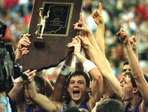 March 1990, Damon Bailey holds up the boys basketball championship trophy after leading his team, Bedford North Lawrence, to a state finals victory at the Hoosier Dome. (Mike Fender Photo/ The Indianapolis News)