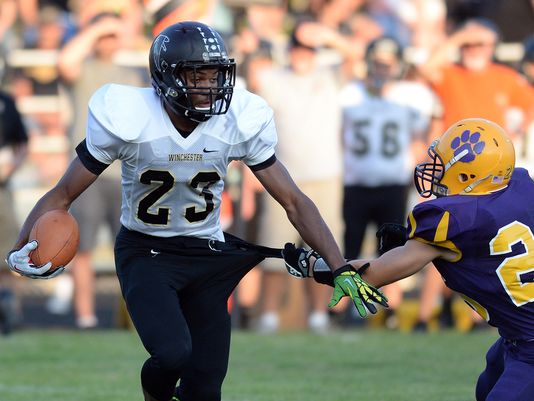 Winchester Community's Kiante Enis, left, broke the school record for rushing yards in a game with 392 yards on 17 carries against Hagerstown on Sept. 5, 2014. (Photo: Joshua Smith, Richmond Palladium-Item via Detroit Free Press)