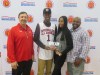 Kobi Jordan-Simmons presents his American Family Insurance Dream Champion award to his parents (Photo: McDonald's All American Game)
