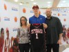 Zach Collins poses with his parents after receiving his McDonald's All American jersey (Photo: McDonald's All American Game)