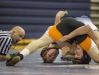 Official Kenneth Nicholl keeps an eye on the action as Marysville's Derek White wrestles Armada's Brennen Steinbauer during a wrestling meet Wednesday, Feb. 10, 2016 at Marysville High School.