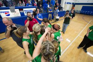 Jenkins guard Whitney Creech is surrounded by her team after she scored 71 pounts against Paintsville in overtime to become the all-time scorer in Kentucky at 4, 957 Tuesday February 2, 2016 in Paintsville, Ky. Creech started the game 63 points shy of becoming the state's top scorer. (John Flavell/Special to the C-J)