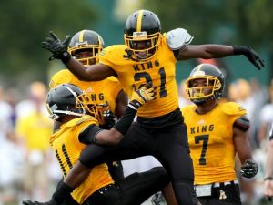 Detroit Martin Luther King's Lavert Hill celebrates his game-saving interception in front of Warren De La Salle's Myles Charlie during the Prep Kickoff Classic on Aug. 29, 2015 at Wayne State's Tom Adams Field in Detroit. (Photo: Kirthmon F. Dozier, Detroit Free Press)