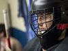 Port Huron goalie Ally Fetterly listens as head coach Ben Poink talks with players in the locker room during a practice at McMorran Arena in Port Huron.