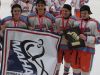 (From left) Teirnan Shoudy, Jacob Truscott, Mark Estapa and Travis Shoudy pose with the MAHA state title banner and trophy.
