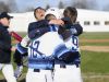 Stefan Fenwick smiles as he celebrates Richmond's walk-off win with Chase Churchill (9) and Connor Margosian (12) on April 13, 2016 at Richmond High School.