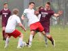 Riverheads' Elijah Knopp (center) tries to keep Stuarts Draft's Joshua Huff away from the ball as they battle for control of it during a soccer game played in Greenville on Friday, April 22, 2016.