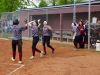 Stuarts Draft's Rendy Dressler, left, is greeted by teammates Courtney Black, center, and Sydney Montoya after scoring the winning run in the Cougars' game against Fort Defiance on Wednesday, April 27, 2016, in Stuarts Draft.