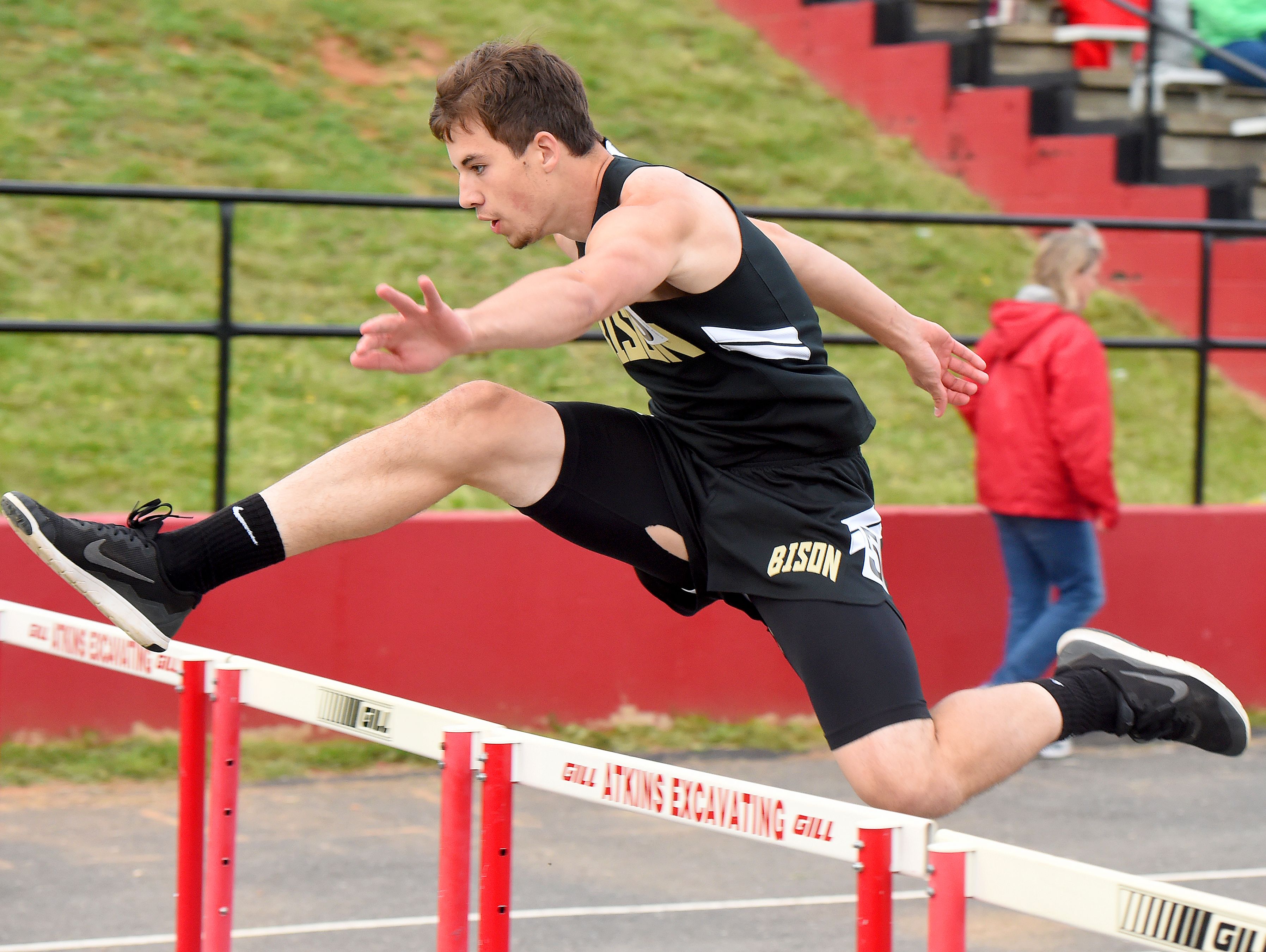 Buffalo Gap's Logan Miller clears a hurdle as he competes in the boys' 110 meter hurdles during the 28th annual Augusta County Invitational Track Meet held in Greenville on Friday, April 29, 2016.