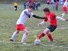 Riverheads’ Rinaldo Martina battles East Rockingham’s John Helmondollar for the ball during a soccer game played in Greenville on Friday.