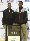 Bruce Brown (left) poses after receiving a banner for the school for making the Jordan Brand Classic (Photo: Jordan Brand Classic)
