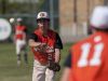 Armada's Kade Cohoon throws the ball to first for an out during a baseball game Tuesday, May 24, 2016 at Richmond High School.