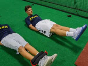 Teammates Daniel Valdes and Chrisitan Odio workout during a Fort Myers Baseball Academy team practice Tuesday evening in Fort Myers. (Photo: Ricardo Rolon / The News-Press, Ricardo Rolon / The News-Press)