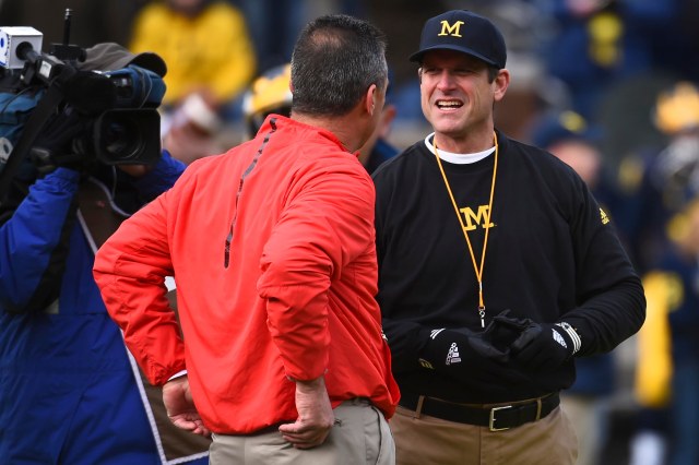 Michigan coach Jim Harbaugh (right) found a foe in his rivalry against Ohio State coach Urban Meyer (left) in the form of New Jersey prep football. (Tim Fuller/USA TODAY Sports)