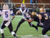 Akron Hoban's Tyler Gilchrist pulls down Zanesville's Derek Grandstaff on Friday night during the Division III state semifinals in Massillon. The Blue Devils' fell to the Knights, 33-21.