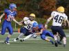 Grace Christian's Thomas Musselman, lower right, brings down a Rappahannock ballcarrier during their football game Oct. 24, 2015.