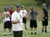 Wilson Memorial High School football coach Jeremiah Major runs drills during the first day of practice on Thursday, July 28, 2016.