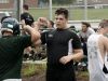 Sophomore Xavier Black arm bumps teammates as they take a water break during Wilson Memorial High School first day of football practice on Thursday, July 28, 2016.