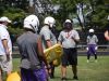 Waynesboro assistant coach Shawn Moran guides the Little Giants though an offensive drill during the first day of practice on Thursday, July 28, 2016, at Waynesboro High School