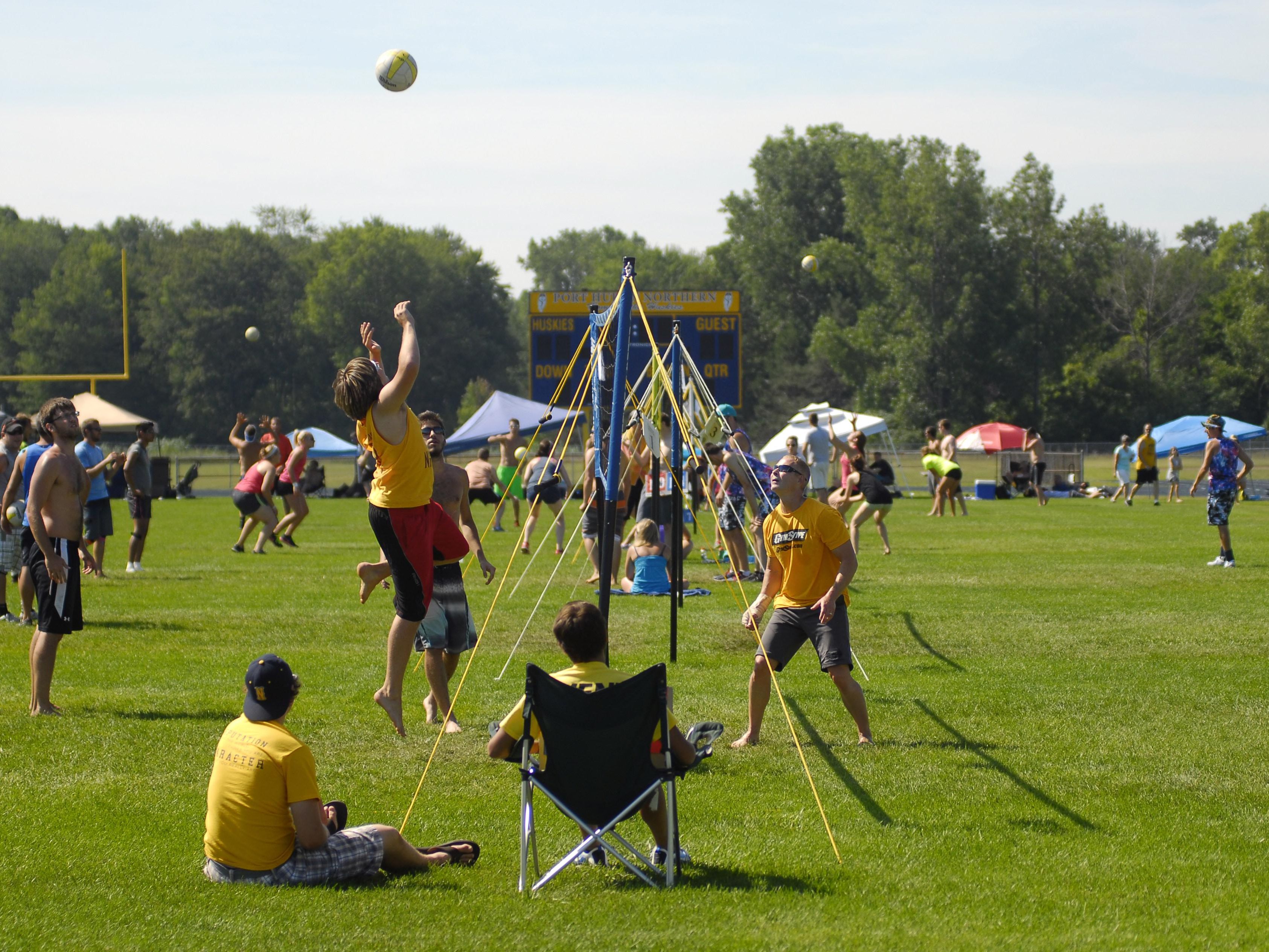 Players take to the grass Sunday, July 26, during the annual Volleygrass volleyball tournament at Port Huron Northern.