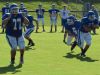 Fort Defiance's Austin Fitzwater, right, runs upfield after taking a handoff from quarterback Jacob Jones, while lineman Dakota Morris, left, gets in a blocking stance during a preseason practice Wednesday, Aug. 10, 2016, at Fort Defiance High School.