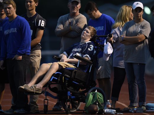 Baylor Bramble visits the sideline to watch his teammates take on the Ravenwood Raptors for their season opener at Siegel High School (Photo: Greg Walker IV, The Tennessean)