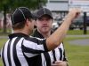 First-year referee Daniel Roquemore of Staunton talks about a play with second-year referee Eric Trynovich of Waynesboro during the Riverheads High School 2016 football jamboree on Aug. 20, 2016.