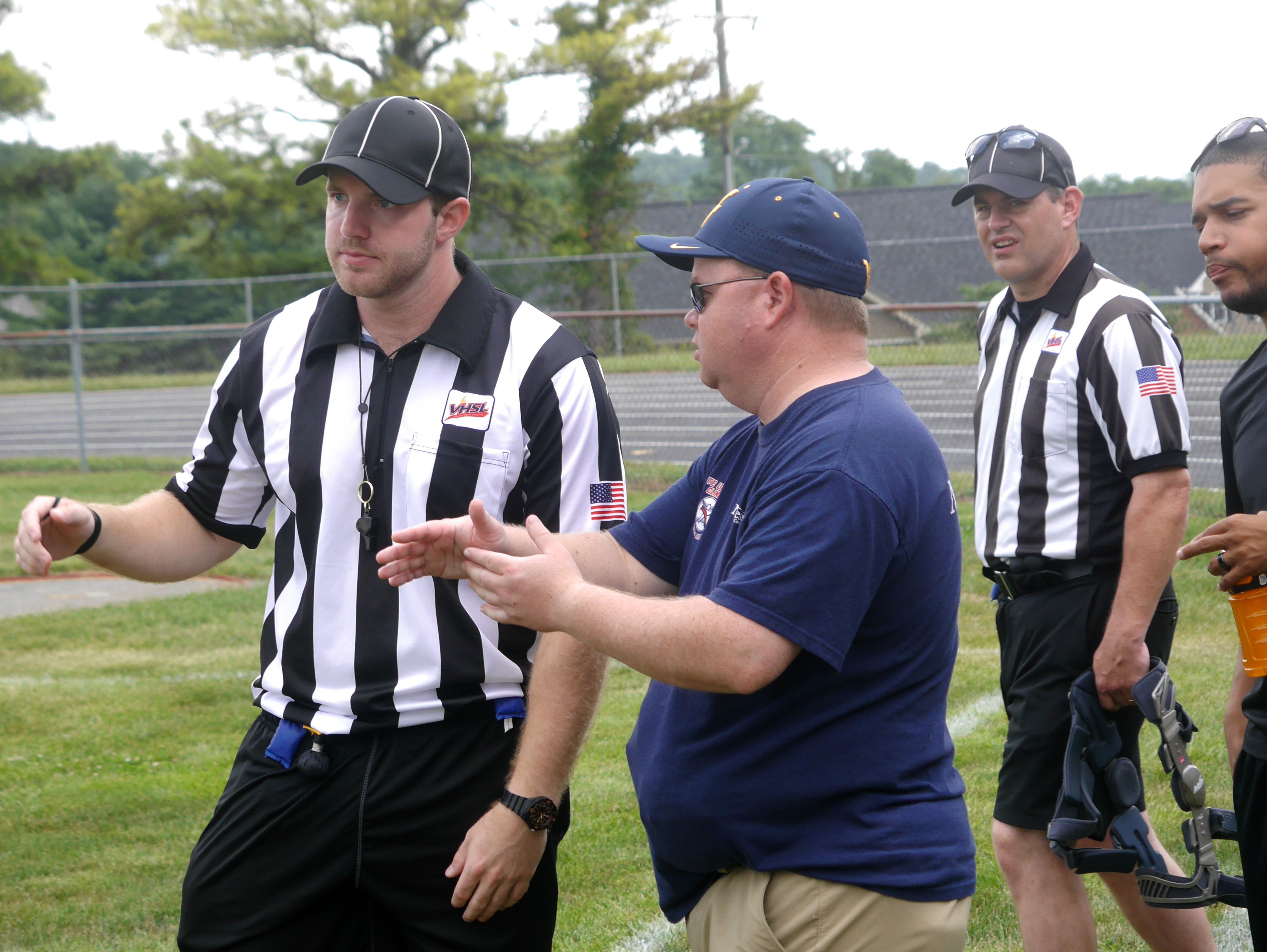 The players weren't the only ones using the Fort Defiance vs James River scrimmage to tune-up for the high school football season, first-year referee Daniel Roquemore of Staunton gets some advice from PVFOA commissioner Dave Moore during the Riverheads High School 2016 football jamboree on Aug. 20, 2016.