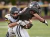 Algonac's Brandon Spencer takes down Marine City's William Patsalis during a football game Thursday, August 25, 2016 at East China Stadium.