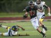 Marine City's William Pastalis breaks past several Algonac defenders as he drives the ball down field during a football game Thursday, August 25, 2016 at East China Stadium.