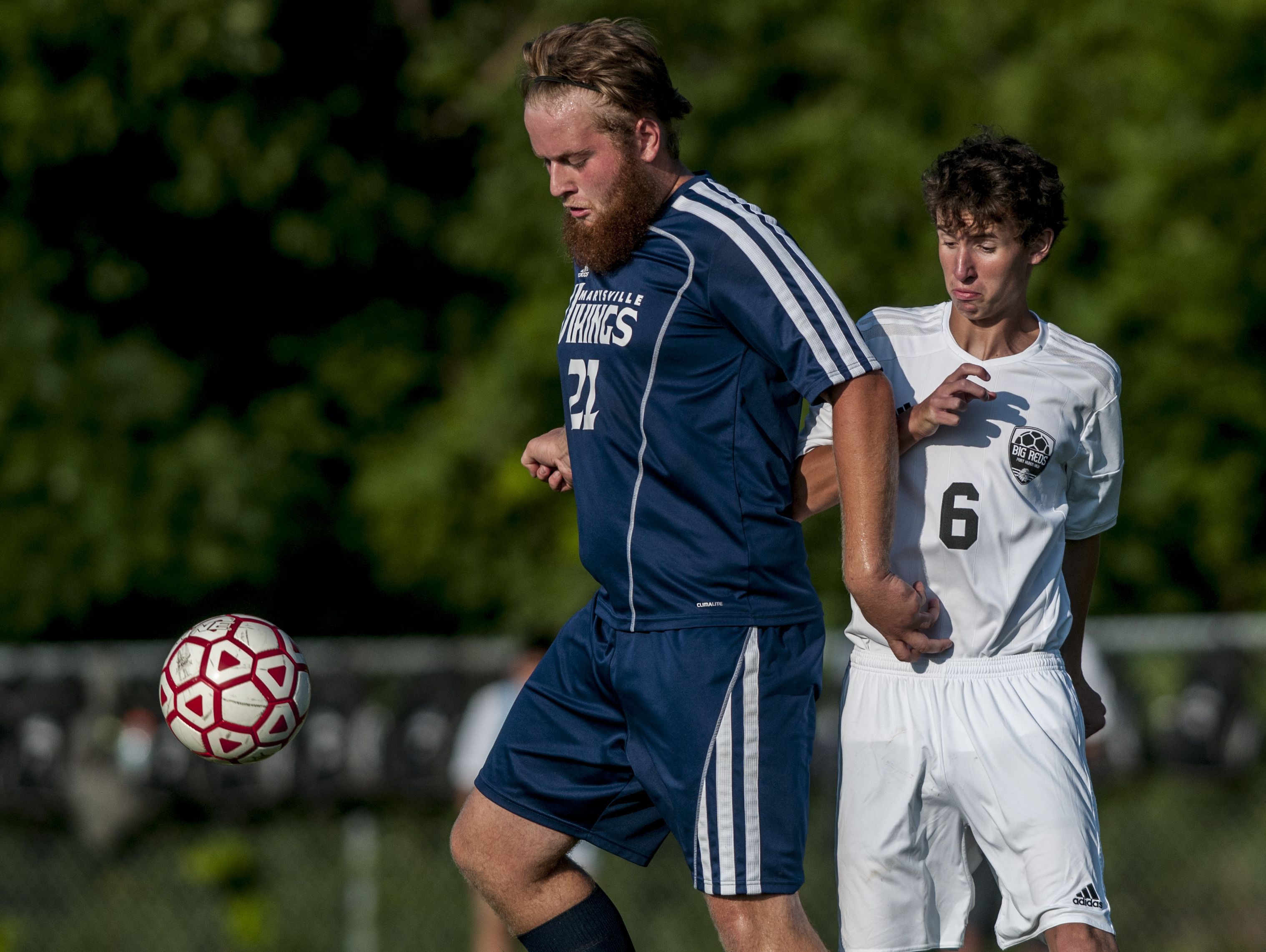 Marysville's Bryan DiNardo controls the ball in front of Port Huron's Joey Holzberger during a soccer game Wednesday, August 31, 2016 at Port Huron Northern High School.