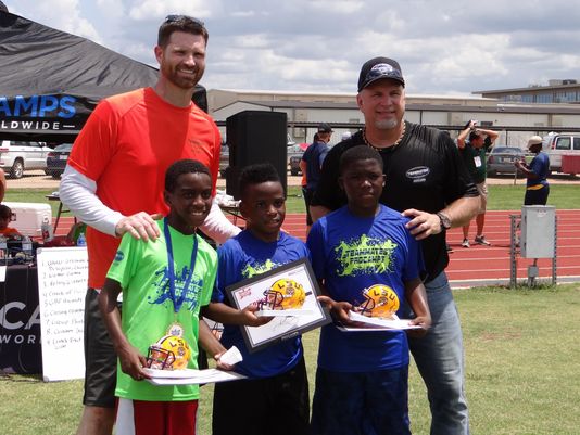 Garth Brooks (right) led a football/team building camp. (Photo: Christi Johnson, Special to Shreveport Times)