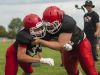 A pair of Big Reds go through a tackling drill Friday, Aug 12, during practice at Port Huron High School.