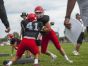 A pair of Big Reds go through a tackling drill Friday, Aug 12, during practice at Port Huron High School.